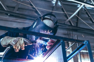 a welder working on a piece of metal